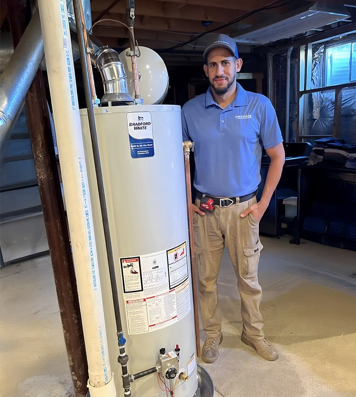 Watkins HVAC Tech with New Water Heater Installation